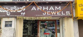 Arham Jewels logo